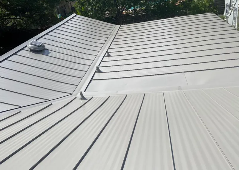 Solar attic fan installed on a metal roof for Roof Ventilation in Upper Dublin